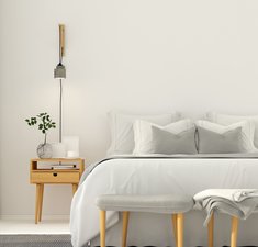 3D illustration. Modern bedroom interior in a light gray color with wooden furniture